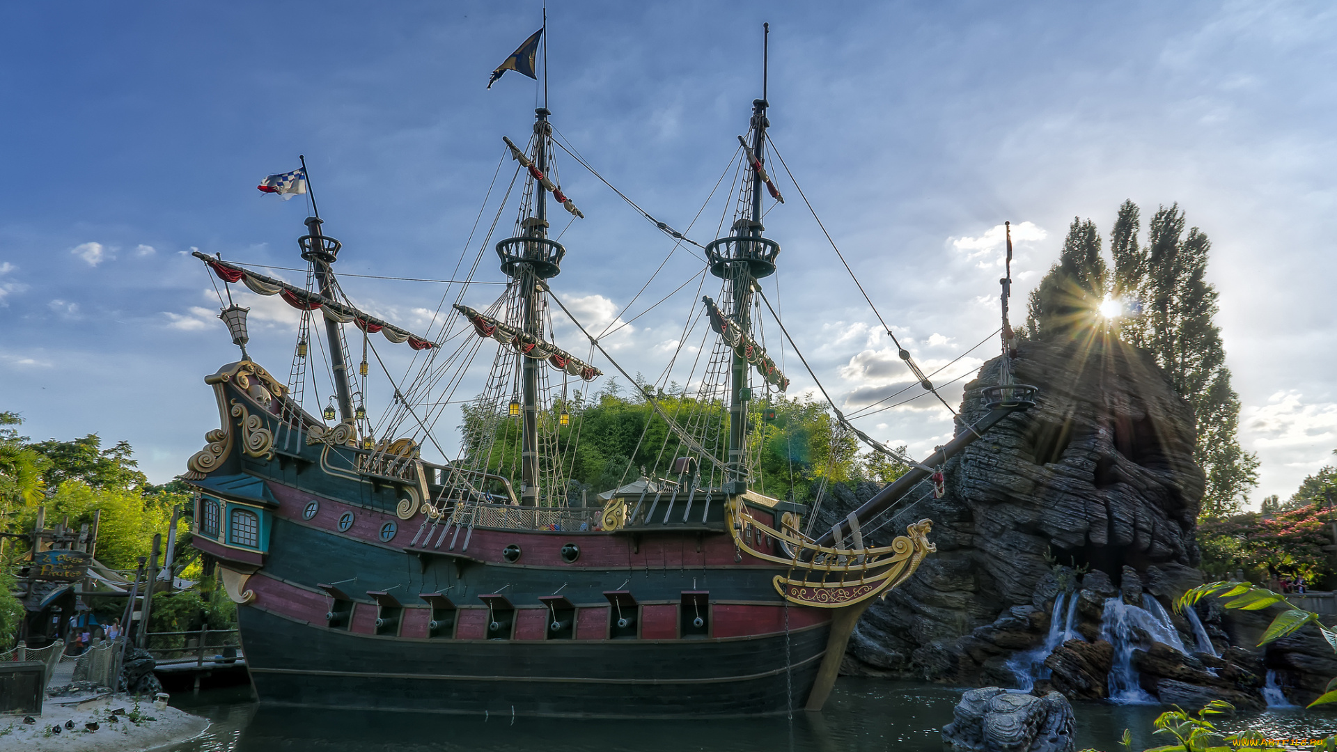 города, диснейленд, парк, солнце, свет, паруса, мачты, корабль, водопад, скала, река